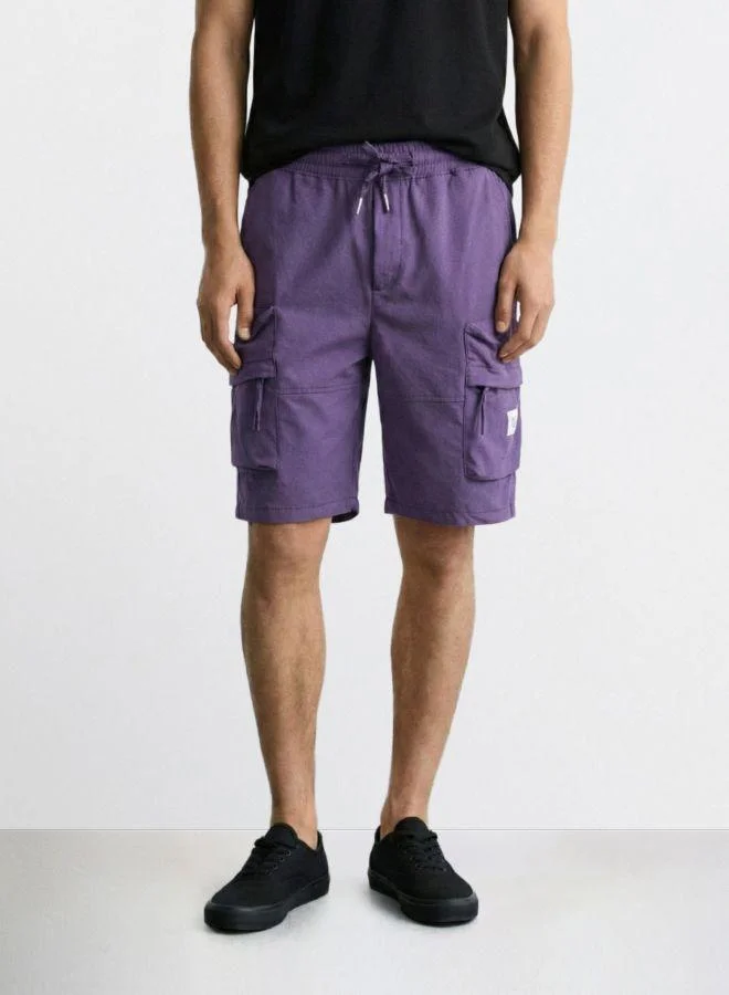 The Indian Garage Co Men Relaxed Fit Solid Cargo Pocket Mid-Rise Cargo Shorts